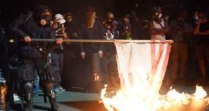 Black Lives Matter Protesters Burn Bibles, US Flag In Portland Bibles on Fire, courthouse in portland