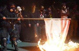 Black Lives Matter Protesters Burn Bibles, US Flag In Portland Bibles on Fire, courthouse in portland